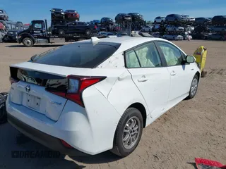 2021 Toyota Prius L Eco with VIN JTDKAMFU2M3147562, listed as a IAAI auction lot 41882066 with 99,491 mi miles. Bid and sale history available at carsss.com. Image 4.