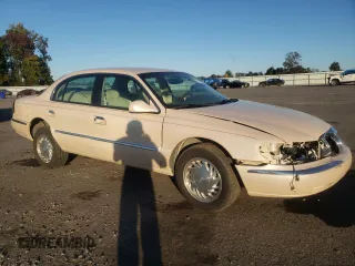 1998 Lincoln Continental with VIN 1LNFM97V3WY647762, listed as a Copart auction lot 77062294 with 153,553 mi miles and Salvage Title. Bid and sale history available at carsss.com. Image 4.