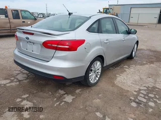 2017 Ford Focus Titanium with VIN 1FADP3J24HL229702, listed as a IAAI auction lot 42057013 with 120,250 mi miles and . Bid and sale history available at DreamBid. Image 4.