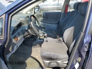 2002 Suzuki Aerio S z VIN JS2RA41S225109275, wystawiony jako Copart lot #52689585 z przebiegiem 195 612 mil mil oraz Tytuł czysty. Historia ofert i sprzedaży dostępna na DreamBid. Obrazek 7.