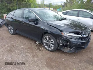 2018 Honda Clarity Touring z VIN JHMZC5F33JC002577, wystawiony jako IAAI lot #42332045 z przebiegiem 77 723 mil mil oraz . Historia ofert i sprzedaży dostępna na DreamBid. Obrazek 1.