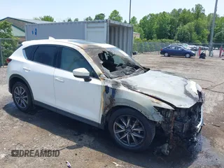 2018 Mazda CX-5 Grand Touring z VIN JM3KFBDM4J0445186, wystawiony jako IAAI lot #42404941 z przebiegiem Nie podano mil oraz . Historia ofert i sprzedaży dostępna na DreamBid. Obrazek 1.