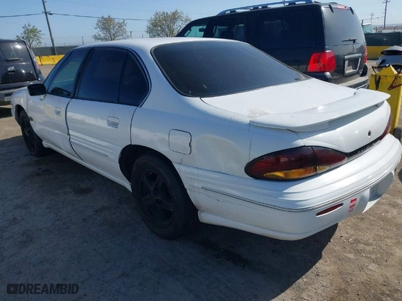 1999 Pontiac Bonneville SE with VIN 1G2HX52KXXH254051, listed as a IAAI auction lot 41990245 with 213,000 mi miles. Bid and sale history available at carsss.com. Image 3.