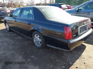 2004 Cadillac DeVille DHS z VIN 1G6KE57YX4U261849, wystawiony jako IAAI lot #41518835 z przebiegiem Nie podano mil oraz . Historia ofert i sprzedaży dostępna na DreamBid. Obrazek 3.