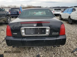 2004 Cadillac DeVille z VIN 1G6KD54Y54U132926, wystawiony jako Copart lot #53574365 z przebiegiem 123 848 mil mil oraz Tytuł czysty. Historia ofert i sprzedaży dostępna na DreamBid. Obrazek 6.