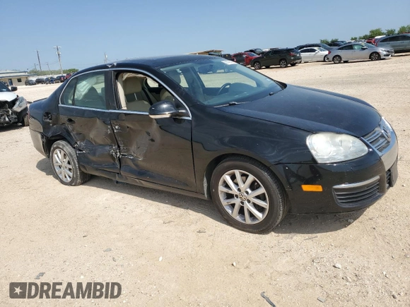2010 Volkswagen Jetta SE with VIN 3VWRX7AJXAM049320, listed as a Copart auction lot 56142005 with 127,002 mi miles and Salvage title. Bid and sale history available at DreamBid. Image 4.