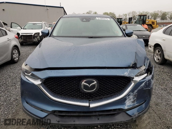 2017 Mazda CX-5 Touring with VIN JM3KFBCLXH0124451, listed as a Copart auction lot 51060275 with 126,807 mi miles and Salvage Title. Bid and sale history available at carsss.com. Image 5.