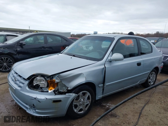 2003 Hyundai Accent GL with VIN KMHCG35C23U264360, listed as a IAAI auction lot 42033316 with 100,991 mi miles. Bid and sale history available at carsss.com. Image 17.