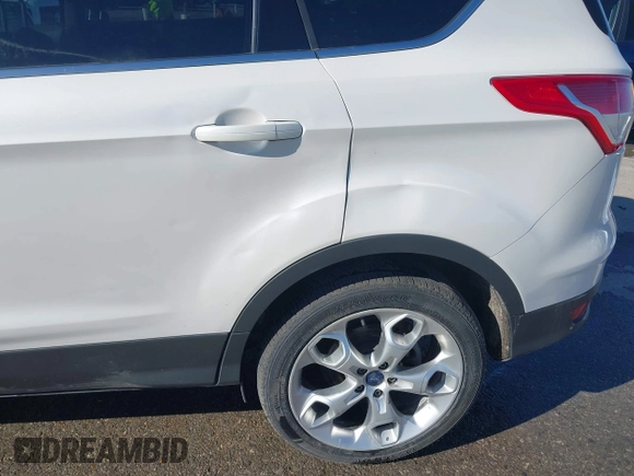 2013 Ford Escape Titanium with VIN 1FMCU0J96DUA71857, listed as a IAAI auction lot 41877003 with 118,864 mi miles and . Bid and sale history available at carsss.com. Image 6.
