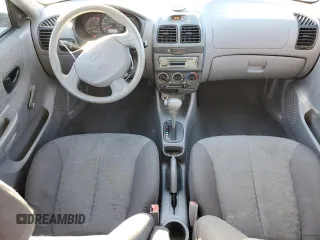2005 Hyundai Accent GLS with VIN KMHCG45C95U665574, listed as a Copart auction lot 82603804 with 154,187 mi miles and Salvage Title. Bid and sale history available at carsss.com. Image 8.