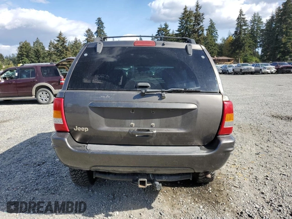 1999 Jeep Grand Cherokee Limited with VIN 1J4GW68S2XC677334, listed as a Copart auction lot 74152054 with 242,220 mi miles and Salvage Title. Bid and sale history available at carsss.com. Image 6.