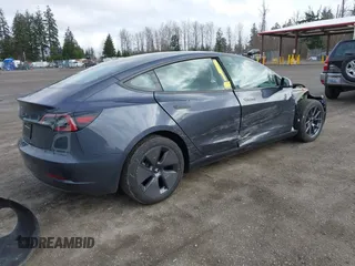 2023 Tesla Model 3 with VIN 5YJ3E1EA2PF623217, listed as a IAAI auction lot 41701413 with 21,246 mi miles and . Bid and sale history available at DreamBid. Image 4.