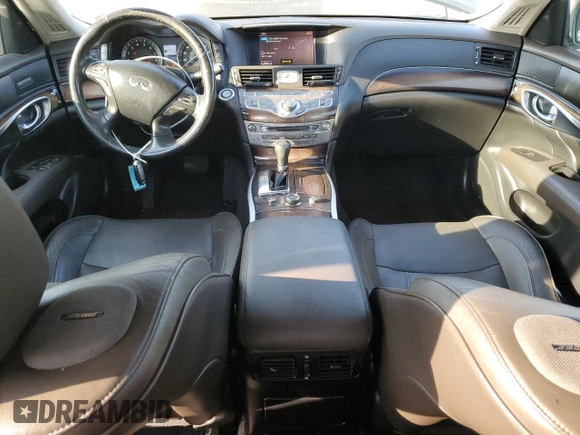 2012 Infiniti M with VIN JN1BY1AP9CM331047, listed as a Copart auction lot 49730015 with 125,263 mi miles and Salvage Title. Bid and sale history available at DreamBid. Image 8.