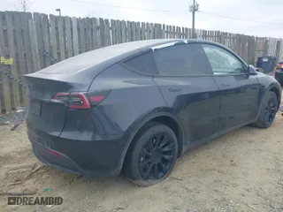 2024 Tesla Model Y with VIN 7SAYGDED6RF190762, listed as a IAAI auction lot 41800763 with 12,644 mi miles. Bid and sale history available at carsss.com. Image 4.