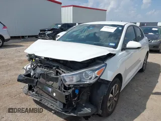 2023 Kia Rio S z VIN 3KPA24AD7PE550899, wystawiony jako IAAI lot #41882407 z przebiegiem 24 966 mil mil oraz . Historia ofert i sprzedaży dostępna na DreamBid. Obrazek 2.