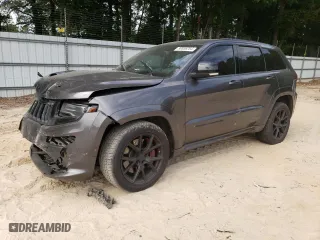 2015 Jeep Grand Cherokee SRT with VIN 1C4RJFDJ9FC842448, listed as a Copart auction lot 56956284 with 178,141 mi miles and Salvage Title. Bid and sale history available at carsss.com. Image 1.