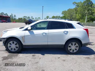 2016 Cadillac SRX Luxury Collection z VIN 3GYFNEE34GS513728, wystawiony jako IAAI lot #41847871 z przebiegiem 109 045 mil mil oraz . Historia ofert i sprzedaży dostępna na DreamBid. Obrazek 14.