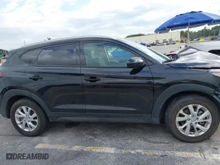 2019 Hyundai Tucson Value with VIN KM8J33A40KU068014, listed as a IAAI auction lot 40877057 with 34,966 mi miles. Bid and sale history available at carsss.com. Image 13.