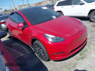 2023 Tesla Model Y Long Range z VIN 7SAYGAEE2PF978393, wystawiony jako IAAI lot #41807079 z przebiegiem 14 009 mil mil oraz . Historia ofert i sprzedaży dostępna na DreamBid. Obrazek 1.
