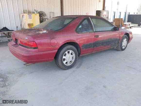 1995 Ford Thunderbird LX with VIN 1FALP62W6SH176090, listed as a IAAI auction lot 42009138 with 114,575 mi miles. Bid and sale history available at carsss.com. Image 4.