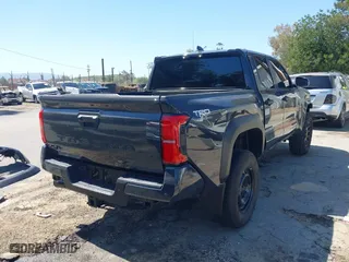 2024 Toyota Tacoma 4WD SR5 with VIN 3TMLB5JN4RM039036, listed as a IAAI auction lot 41813562 with 2,112 mi miles. Bid and sale history available at carsss.com. Image 4.
