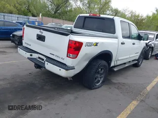 2014 Nissan Titan Pro-4X with VIN 1N6BA0ECXEN501915, listed as a IAAI auction lot 42097967 with 120,851 mi miles and . Bid and sale history available at DreamBid. Image 4.