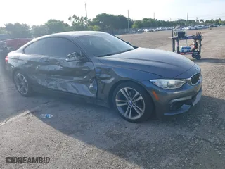 2014 BMW 4 Series 428i xDrive with VIN WBA3N5C57EK196790, listed as a IAAI auction lot 40571670 with 108,114 mi miles. Bid and sale history available at carsss.com. Image 1.