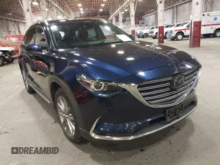 2021 Mazda CX-9 Carbon Edition with VIN JM3TCBDY2M0532962, listed as a IAAI auction lot 42450990 with 52,810 mi miles and . Bid and sale history available at DreamBid. Image 1.