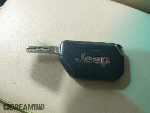 2022 Jeep Wrangler Unlimited Sport with VIN 1C4HJXDG3NW117155, listed as a IAAI auction lot 40240879 with 36,323 mi miles and . Bid and sale history available at DreamBid. Image 11.