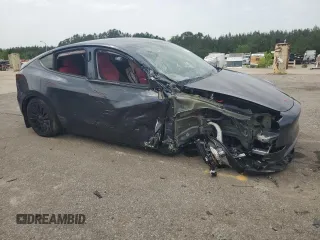 2024 Tesla Model Y z VIN 7SAYGDED4RA331714, wystawiony jako Copart lot #57043915 z przebiegiem Nie podano mil oraz Szkoda całkowita • Salvage title. Historia ofert i sprzedaży dostępna na DreamBid. Obrazek 4.