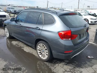 2013 BMW X1 28i with VIN WBAVM1C55DVW41609, listed as a IAAI auction lot 41604038 with 126,036 mi miles. Bid and sale history available at carsss.com. Image 3.
