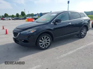 2015 Mazda CX-9 Grand Touring z VIN JM3TB2DA1F0456773, wystawiony jako IAAI lot #42257555 z przebiegiem 152 890 mil mil oraz . Historia ofert i sprzedaży dostępna na DreamBid. Obrazek 21.