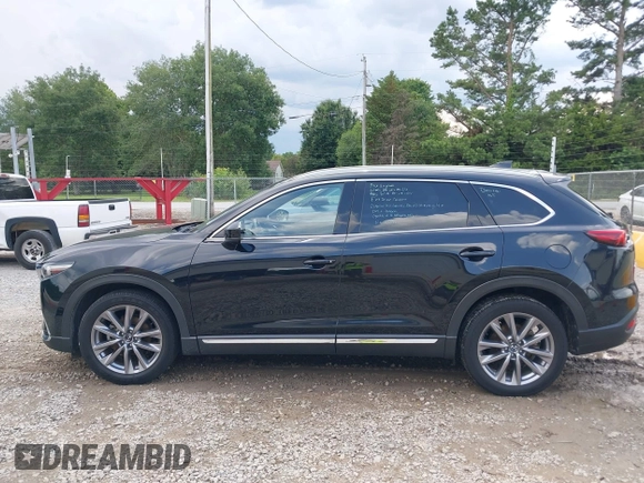 2022 Mazda CX-9 Grand Touring with VIN JM3TCBDYXN0627657, listed as a IAAI auction lot 42498856 with 61,044 mi miles and . Bid and sale history available at DreamBid. Image 14.