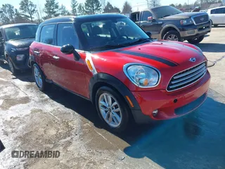2014 MINI Countryman with VIN WMWZB3C50EWR37636, listed as a IAAI auction lot 41628130 with 167,485 mi miles and . Bid and sale history available at DreamBid. Image 1.