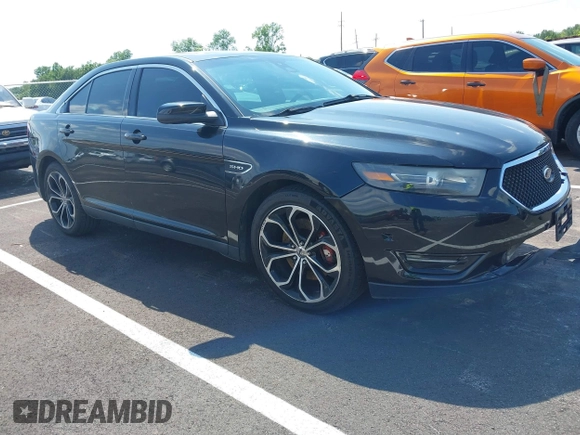 2013 Ford Taurus SHO z VIN 1FAHP2KT1DG135962, wystawiony jako IAAI lot #42449604 z przebiegiem 138 921 mil mil oraz . Historia ofert i sprzedaży dostępna na DreamBid. Obrazek 1.