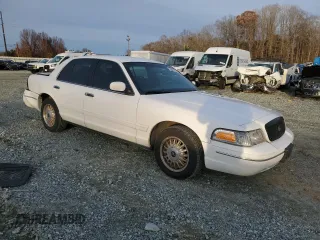 2000 Ford Crown Victoria Police Police Interceptor with VIN 2FAFP71W9YX101655, listed as a Copart auction lot 84666134 with 180,034 mi miles and Salvage Title. Bid and sale history available at carsss.com. Image 4.