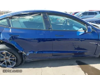 2023 Tesla Model 3 with VIN 5YJ3E1EA9PF697573, listed as a IAAI auction lot 41173833 with 6,966 mi miles. Bid and sale history available at carsss.com. Image 13.