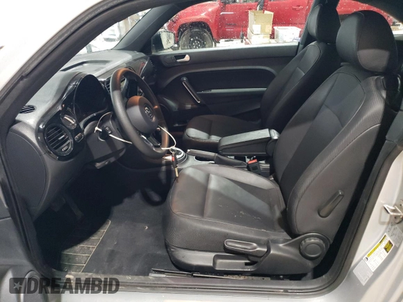 2016 Volkswagen Beetle Wolfsburg Edition with VIN 3VWF17AT3GM602307, listed as a Copart auction lot 56144965 with 63,317 mi miles and Salvage Title. Bid and sale history available at DreamBid. Image 7.