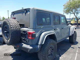 2023 Jeep Wrangler Rubicon with VIN 1C4JJXFG7PW541813, listed as a IAAI auction lot 42640045 with 53,645 mi miles and . Bid and sale history available at DreamBid. Image 4.