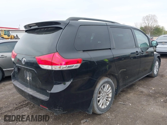 2011 Toyota Sienna XLE AAS with VIN 5TDYK3DC9BS071636, listed as a IAAI auction lot 41972332 with 204,477 mi miles and . Bid and sale history available at DreamBid. Image 4.