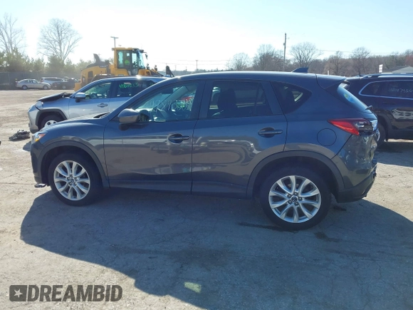 2014 Mazda CX-5 Grand Touring with VIN JM3KE4DY4E0320695, listed as a IAAI auction lot 41989350 with 169,391 mi miles and . Bid and sale history available at DreamBid. Image 15.