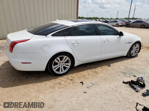 2015 Jaguar XJ Portfolio with VIN SAJWA2GZ7F8V82990, listed as a Copart auction lot 63325535 with 113,892 mi miles and Salvage title. Bid and sale history available at DreamBid. Image 3.