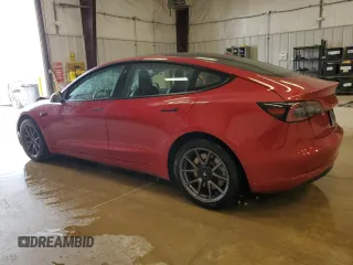 2022 Tesla Model 3 Long Range with VIN 5YJ3E1EBXNF285779, listed as a Copart auction lot 54630135 with 129,097 mi miles and Clean Title. Bid and sale history available at DreamBid. Image 2.