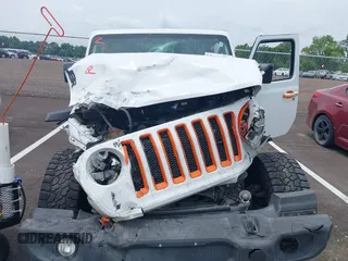 2021 Jeep Wrangler Unlimited Sport S z VIN 1C4HJXDN1MW648061, wystawiony jako IAAI lot #42426882 z przebiegiem 99 008 mil mil oraz . Historia ofert i sprzedaży dostępna na DreamBid. Obrazek 6.