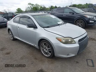 2005 Scion tC with VIN JTKDE177050032815, listed as a IAAI auction lot 42123702 with 228,973 mi miles. Bid and sale history available at carsss.com. Image 1.