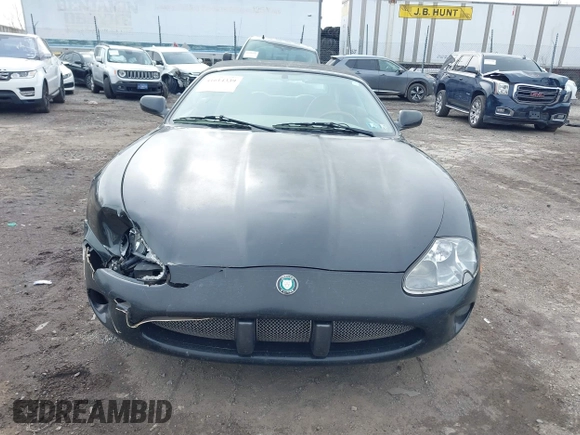 1997 Jaguar XK with VIN SAJGX274XVC017622, listed as a IAAI auction lot 41614339 with 94,298 mi miles and . Bid and sale history available at DreamBid. Image 11.
