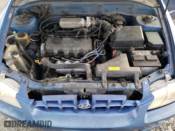 2000 Hyundai Accent z VIN KMHCG45GXYU125691, wystawiony jako Copart lot #87253294 z przebiegiem 91 062 mil mil oraz Szkoda całkowita • Salvage title. Historia ofert i sprzedaży dostępna na DreamBid. Obrazek 11.