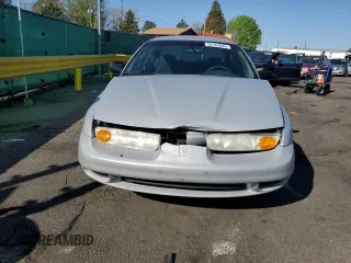 2001 Saturn SL z VIN 1G8ZH52891Z317279, wystawiony jako Copart lot #55163885 z przebiegiem 136 029 mil mil oraz Nie do naprawy • Non repairable. Historia ofert i sprzedaży dostępna na DreamBid. Obrazek 5.