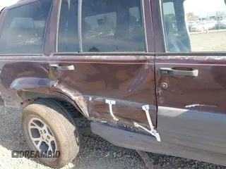 1996 Jeep Grand Cherokee Laredo with VIN 1J4GZ58S2TC262980, listed as a IAAI auction lot 41949514 with 269,674 mi miles and . Bid and sale history available at DreamBid. Image 6.