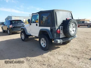 2005 Jeep Wrangler Sport with VIN 1J4FA49SX5P336380, listed as a IAAI auction lot 41752554 with 139,004 mi miles. Bid and sale history available at carsss.com. Image 3.